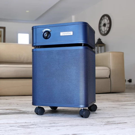 Austin-Air-Healthmate-Midnight Blue in home in front of couch