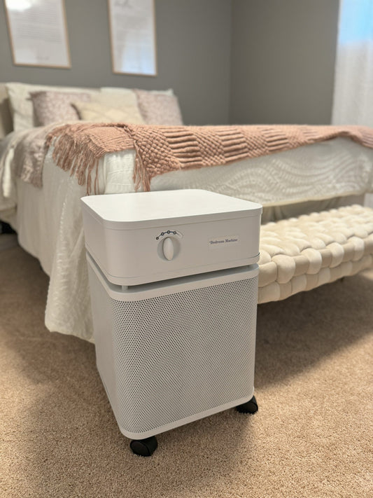 Austin Air Bedroom Machine Air filter in front of bed