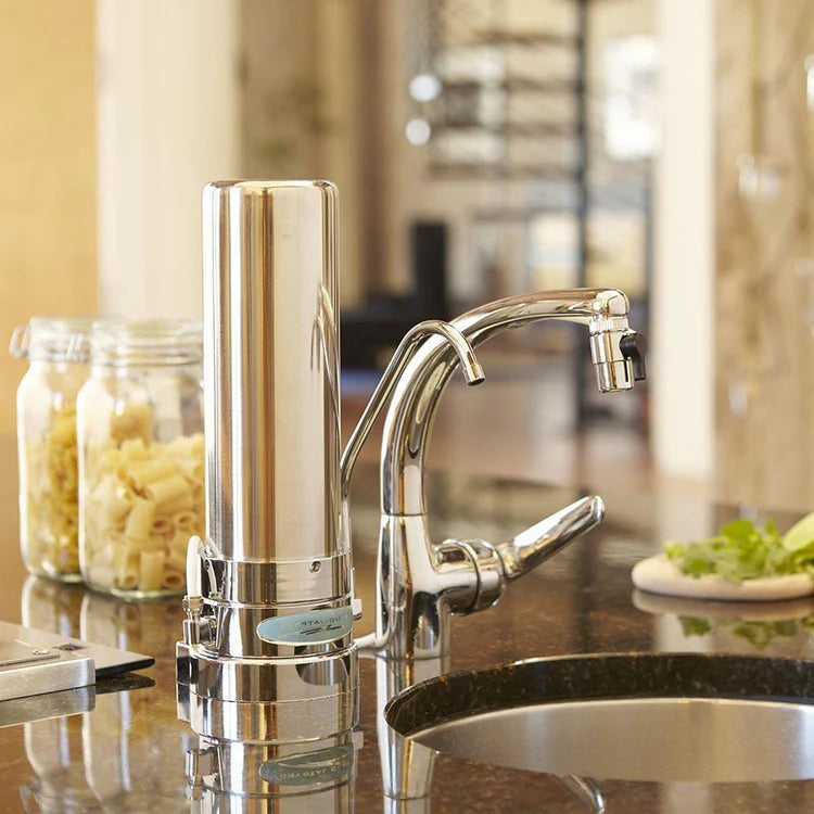 Stainless Steel Fluoride Removal | SMART Single Cartridge Countertop Water Filter System on Counter top next to sink and kitchen faucet